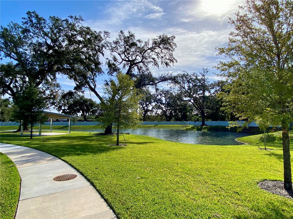 58 Overleaf Lane Orlando, FL 32839 - Photo 39 of 41 a view of a golf course with a lake