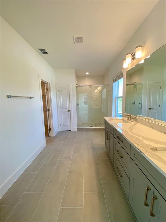 58 Overleaf Lane Orlando, FL 32839 - Photo 6 of 41 a bathroom with a sink and a mirror