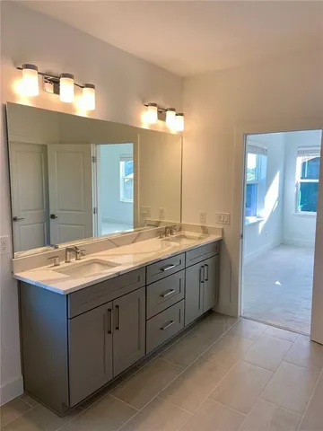 a bathroom with a shower and a sink