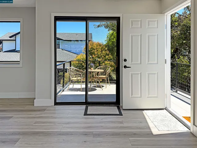 a view of a chairs and table in the patio