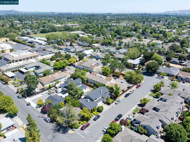 an aerial view of residential houses with outdoor space