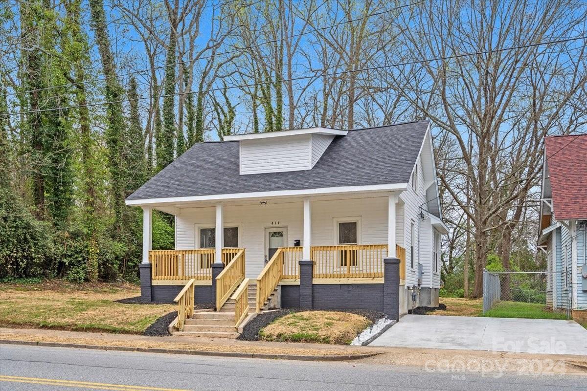 411 West Frederick Street Gaffney, SC 29341 - Photo 2 of 17 a view of a house with a yard and large tree