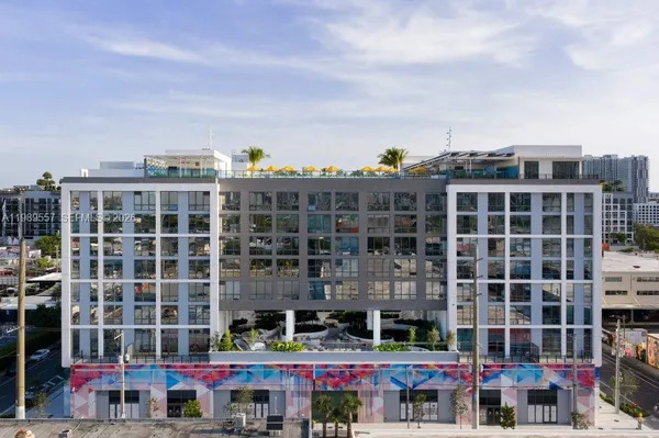 a front view of a building with glass windows