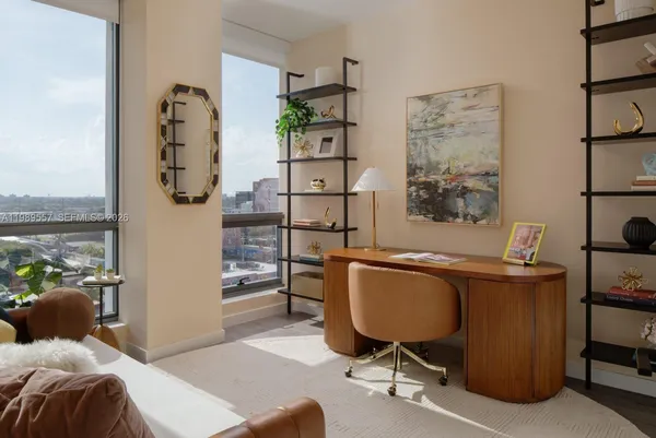 a bedroom with a workspace