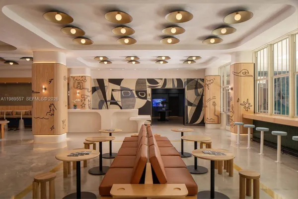 a living room with lots of furniture and gym equipment