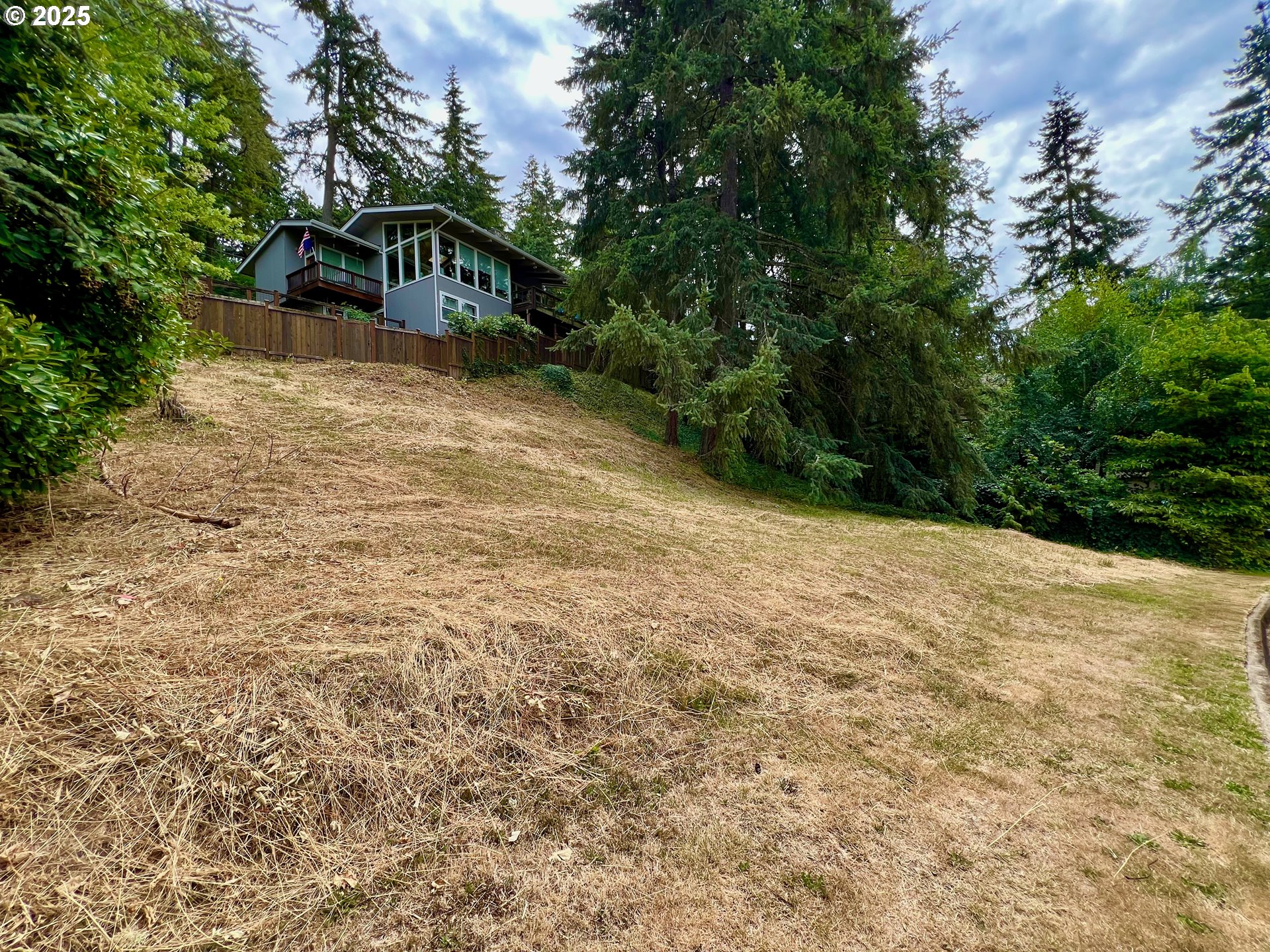 3046 Whitbeck Boulevard Eugene, OR 97405 - Photo 2 of 14 a view of a wooden house with a yard