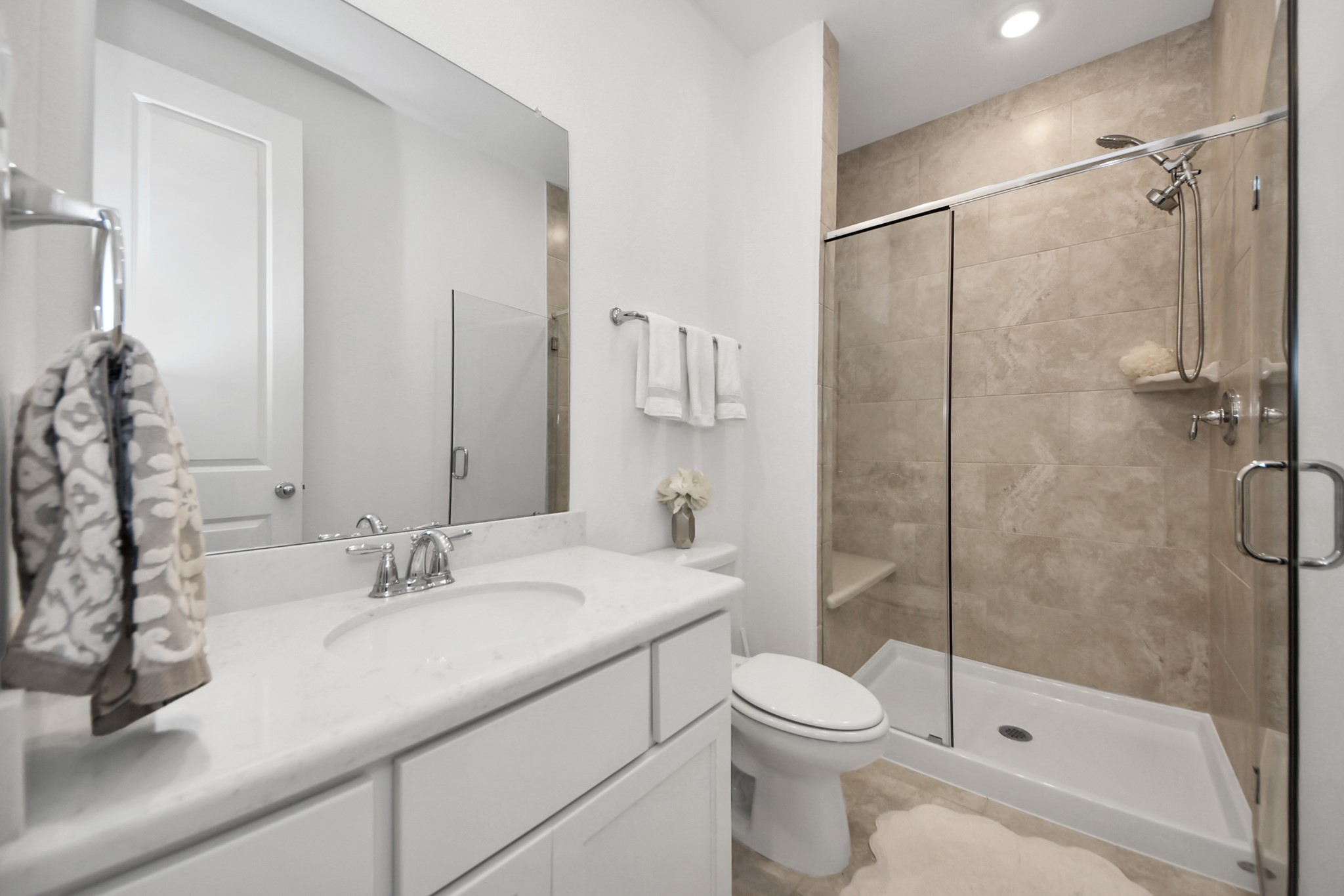 17355 Camillia Trail Conroe, TX 77302 - Photo 19 of 34 a bathroom with a sink toilet and shower