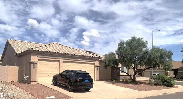 a car parked in front of a house