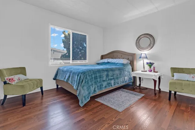 a bedroom with a bed and a table in it