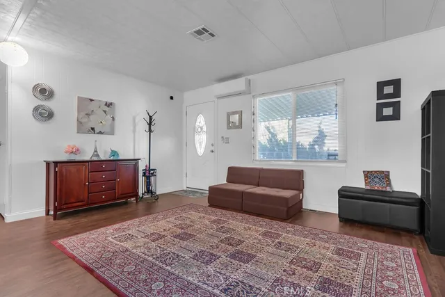 a living room with furniture and a rug