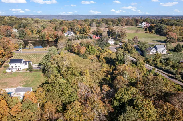 an aerial view of residential building and ocean