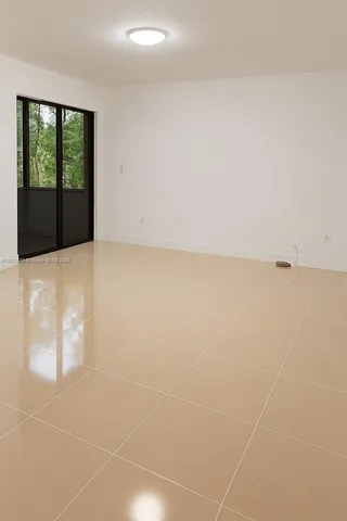 a view of an empty room with windows