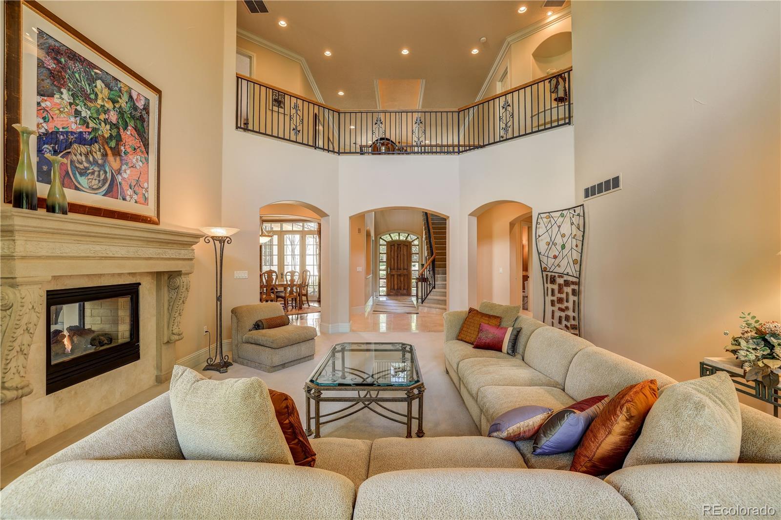 23 Foxtail Circle Cherry Hills Village, CO 80113 - Photo 11 of 40 a living room with furniture and a fireplace