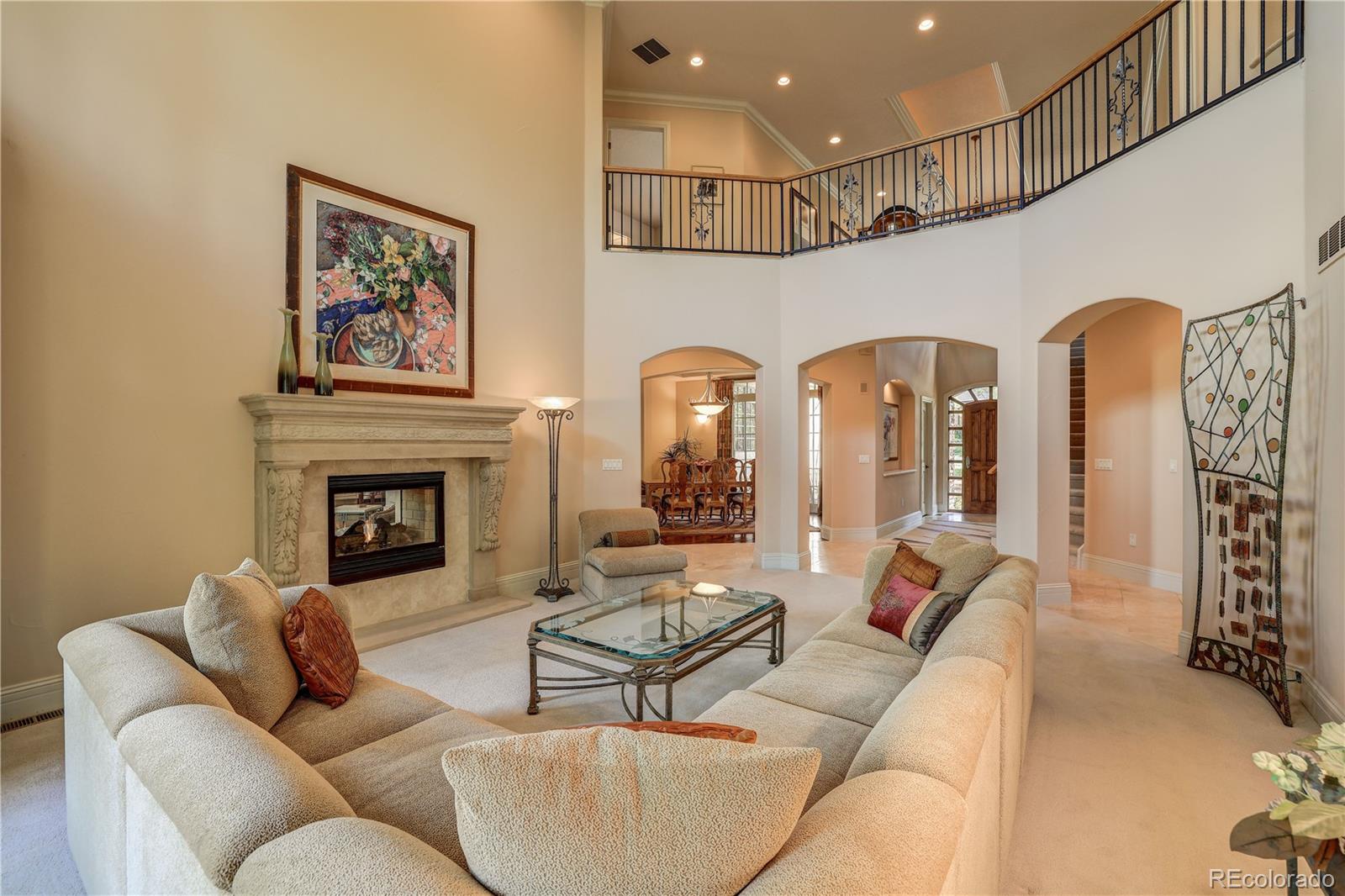 23 Foxtail Circle Cherry Hills Village, CO 80113 - Photo 12 of 40 a living room with furniture and a fireplace