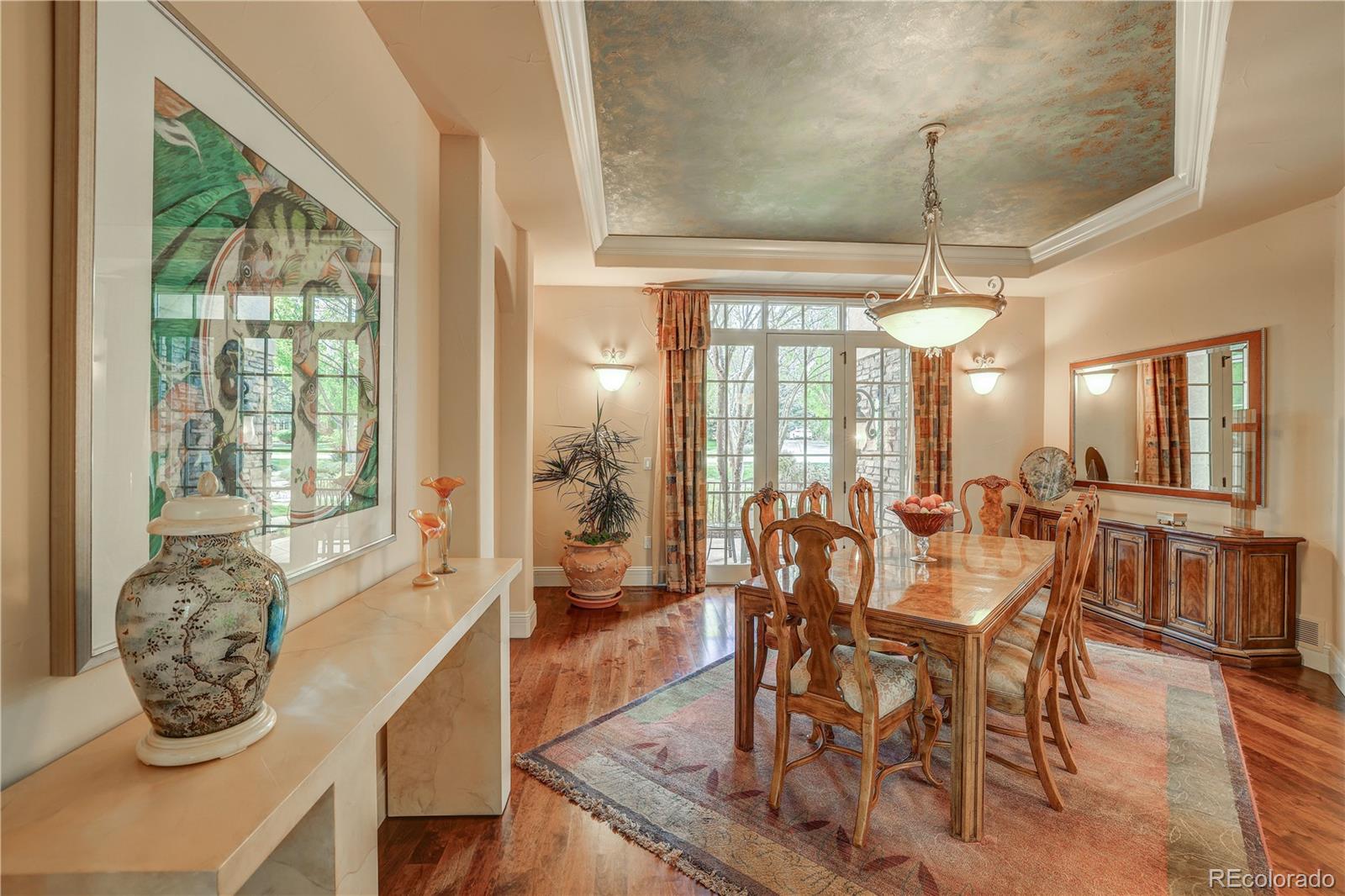 23 Foxtail Circle Cherry Hills Village, CO 80113 - Photo 14 of 40 a dining room with furniture a chandelier and wooden floor