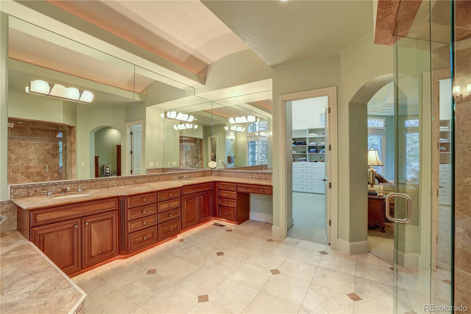 23 Foxtail Circle Cherry Hills Village, CO 80113 - Photo 27 of 40 a large bathroom with a sink and a mirror