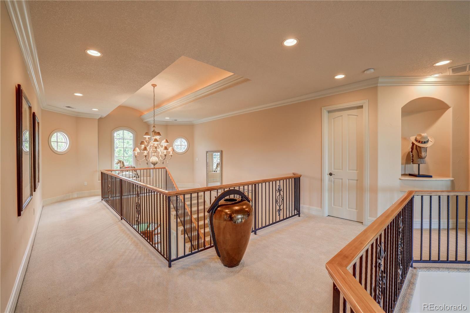 23 Foxtail Circle Cherry Hills Village, CO 80113 - Photo 32 of 40 a view of a hallway with windows