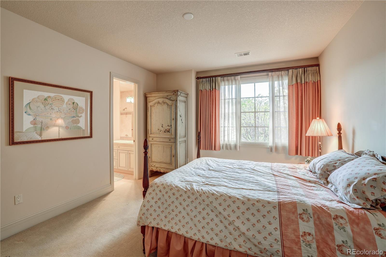 23 Foxtail Circle Cherry Hills Village, CO 80113 - Photo 37 of 40 a bedroom with a bed and a window