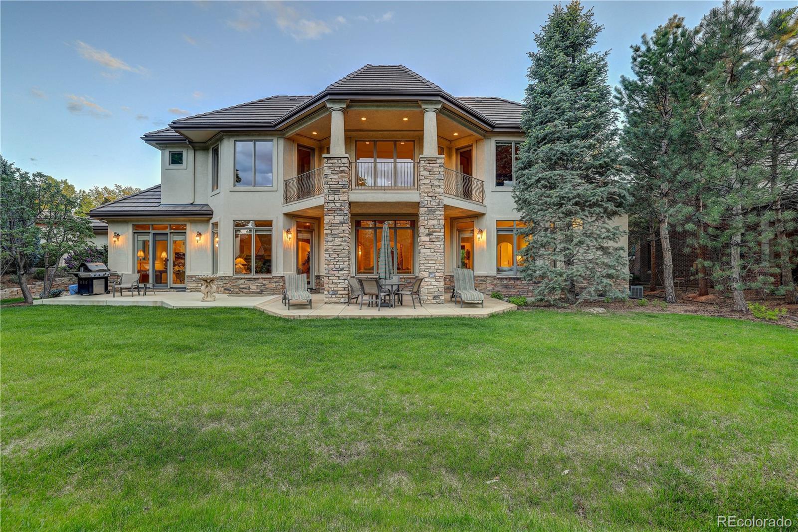 23 Foxtail Circle Cherry Hills Village, CO 80113 - Photo 4 of 40 a front view of a house with garden