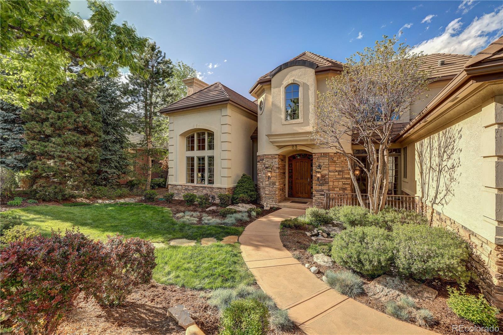 23 Foxtail Circle Cherry Hills Village, CO 80113 - Photo 7 of 40 a front view of a house with garden