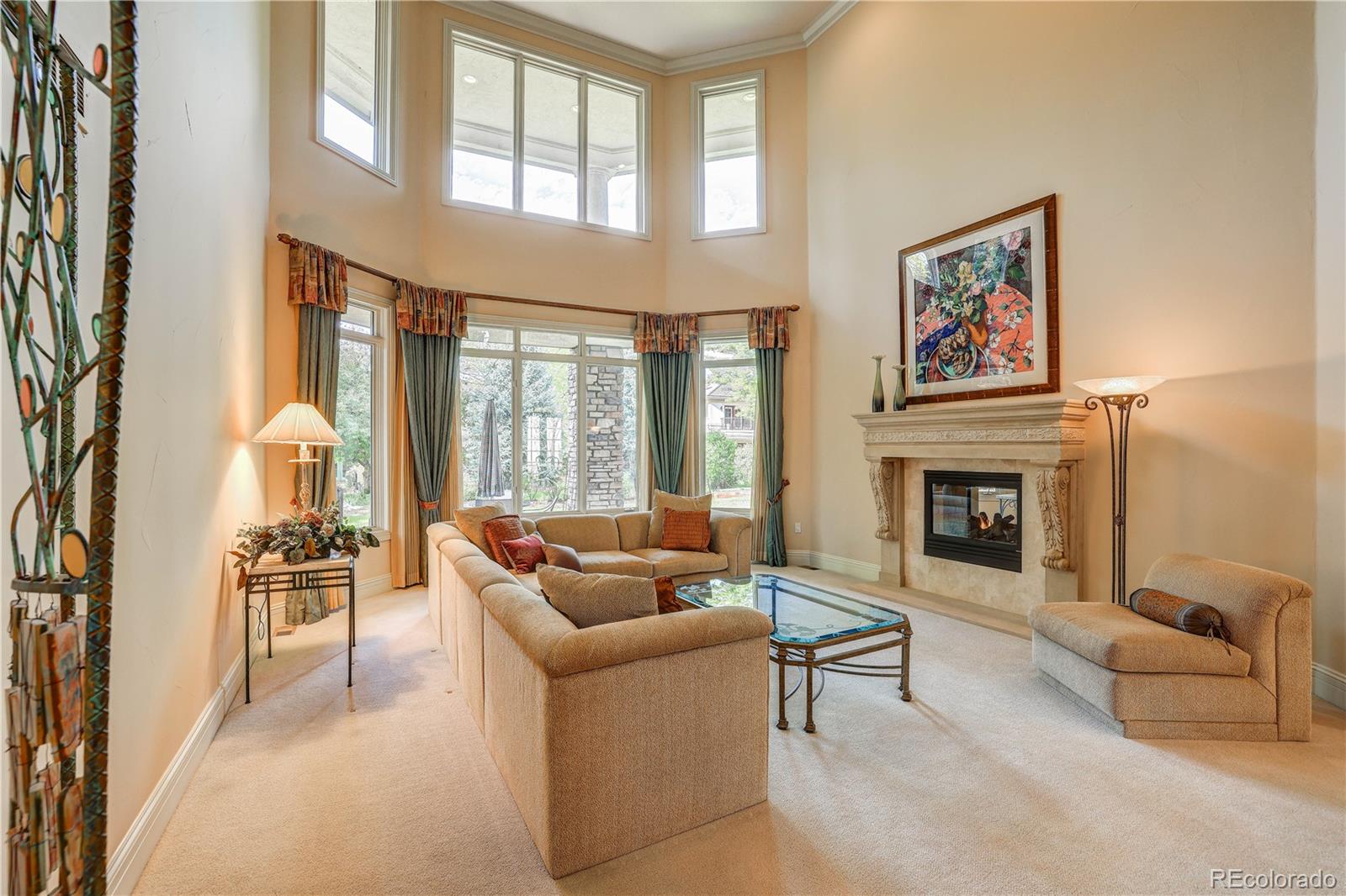23 Foxtail Circle Cherry Hills Village, CO 80113 - Photo 10 of 40 a living room with furniture and a fireplace