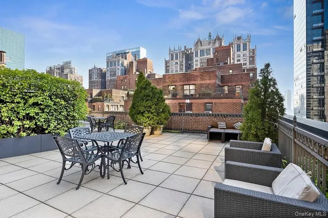 a view of a terrace with sitting area