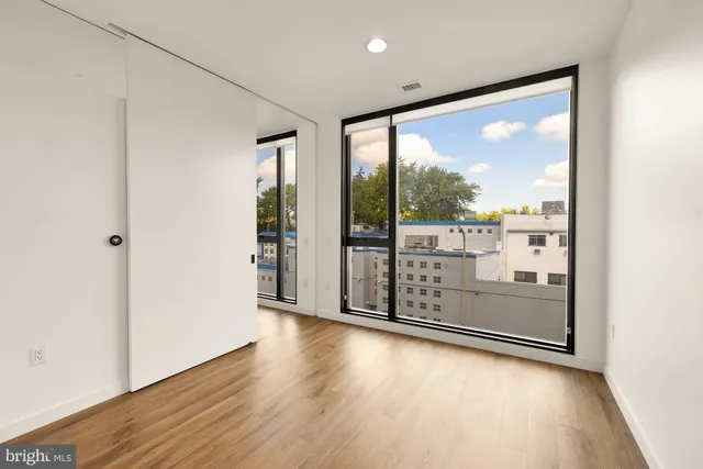 a view of a large window with wooden floor