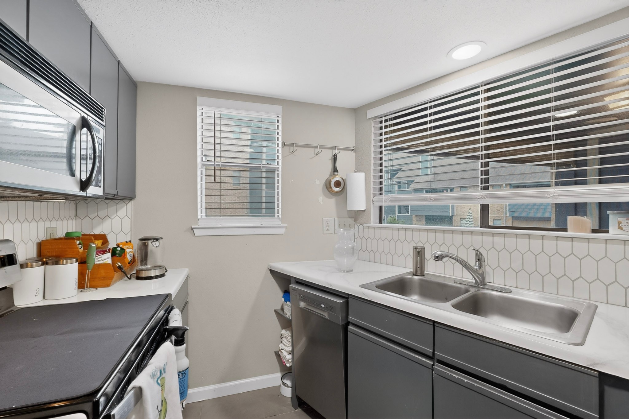 2500 Burleson Road, Unit 506 Austin, TX 78741 - Photo 10 of 23 a kitchen with stainless steel appliances a sink a stove and cabinets
