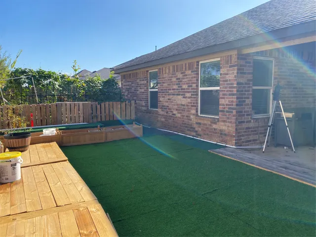 a view of backyard with seating space