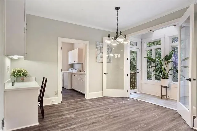 a view of a dining room and a wooden floor