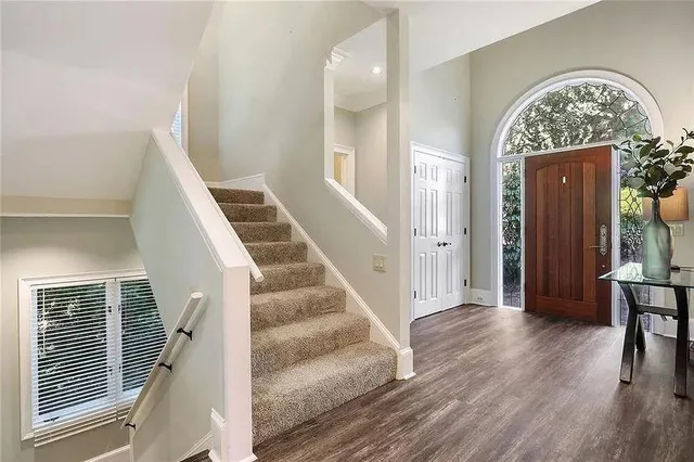 en view interior of a house with wooden floor entryway and windows