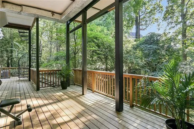 a view of a balcony with wooden floor