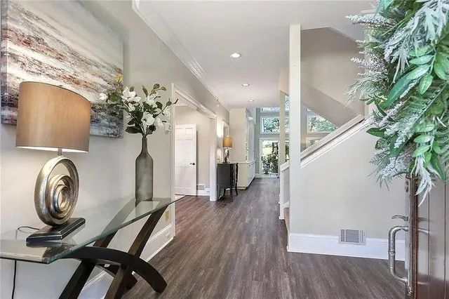 a view of room with furniture and wooden floor