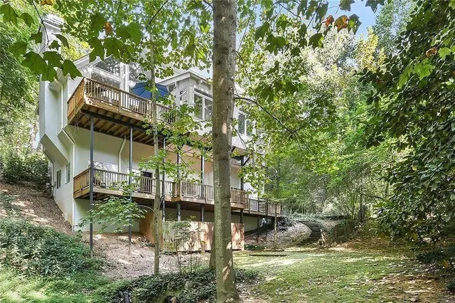 a backyard of a house with lots of green space