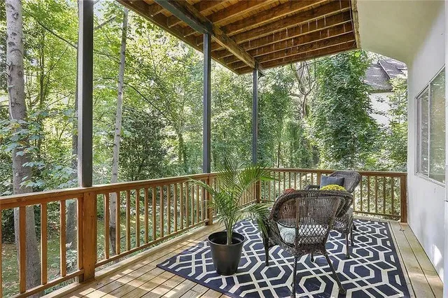 a view of balcony with furniture