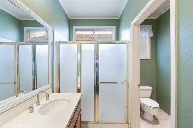 an aerial view of residential houses with outdoor space and river