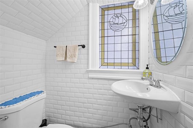 2746 John F. Kennedy Boulevard Jersey City, NJ 07306 - Photo 12 of 37 a bathroom with a sink a toilet and a mirror