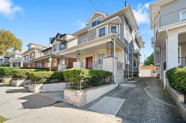 2746 John F. Kennedy Boulevard Jersey City, NJ 07306 - Photo 2 of 37 a front view of a multi story residential apartment building with yard and green space