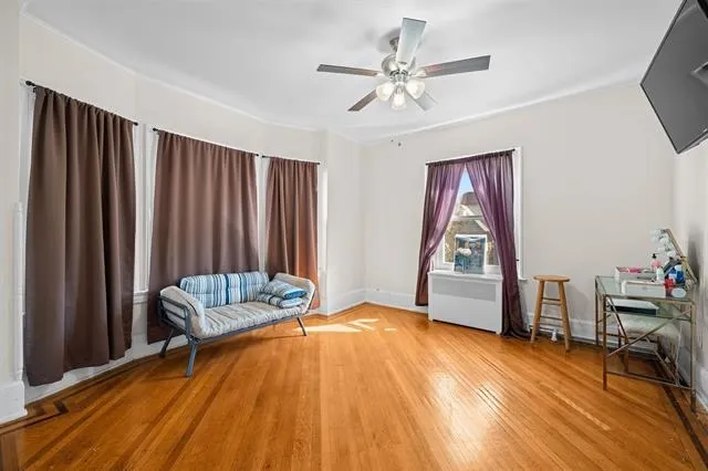 a view of a livingroom with furniture and staircase