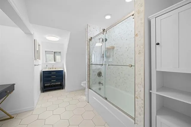 a bathroom with a shower and a tub