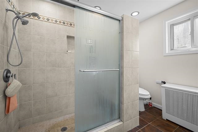 2746 John F. Kennedy Boulevard Jersey City, NJ 07306 - Photo 25 of 37 a bathroom with a shower a toilet and a shower