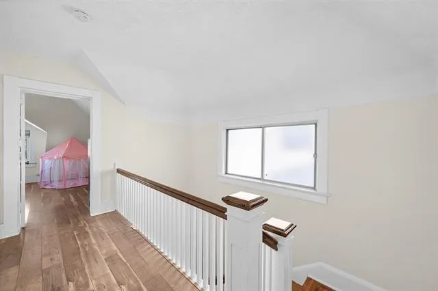 a view of a hallway with a window