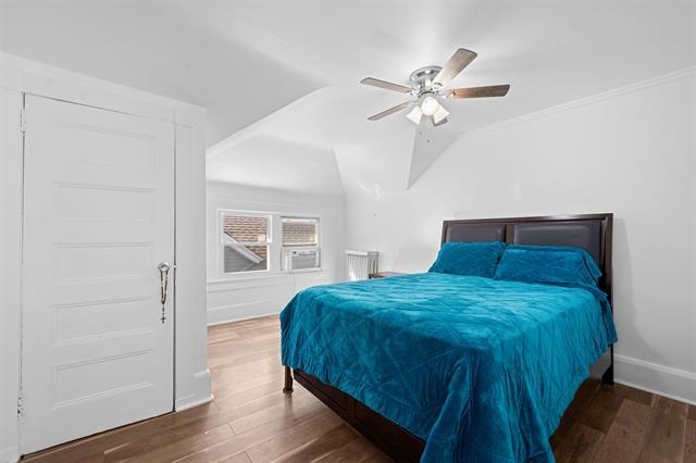 2746 John F. Kennedy Boulevard Jersey City, NJ 07306 - Photo 29 of 37 a bedroom with a bed and a ceiling fan