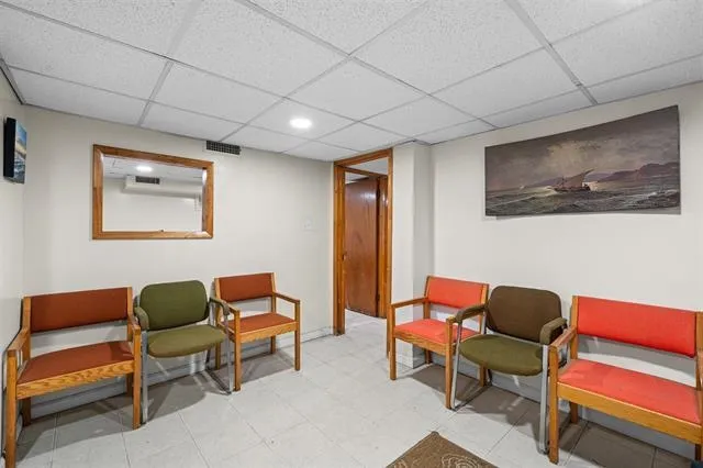 a living room with furniture and a chair