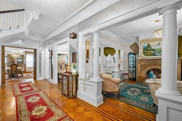 a living room with furniture fireplace and flat screen tv