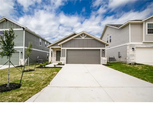 a house with yard in front of it