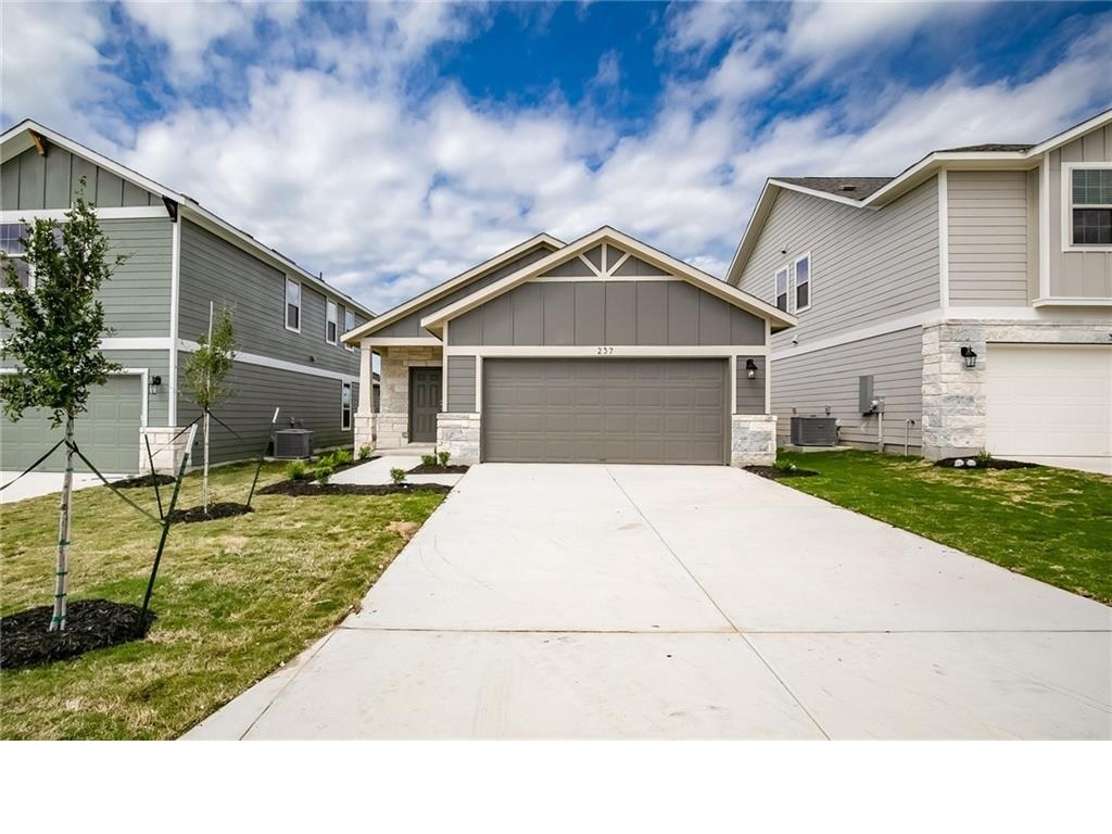 237 Unforgiven Lane Jarrell, TX 76537 - Photo 1 of 20 a house with yard in front of it