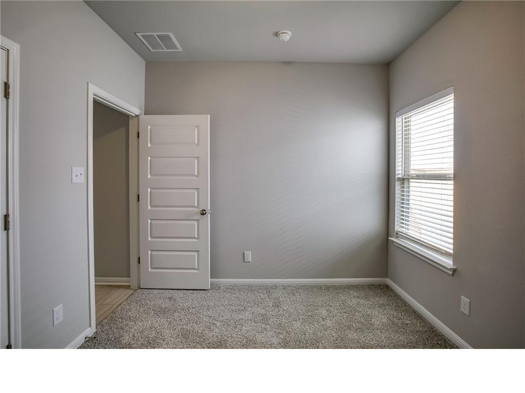 237 Unforgiven Lane Jarrell, TX 76537 - Photo 11 of 20 a black and white photo of a living room