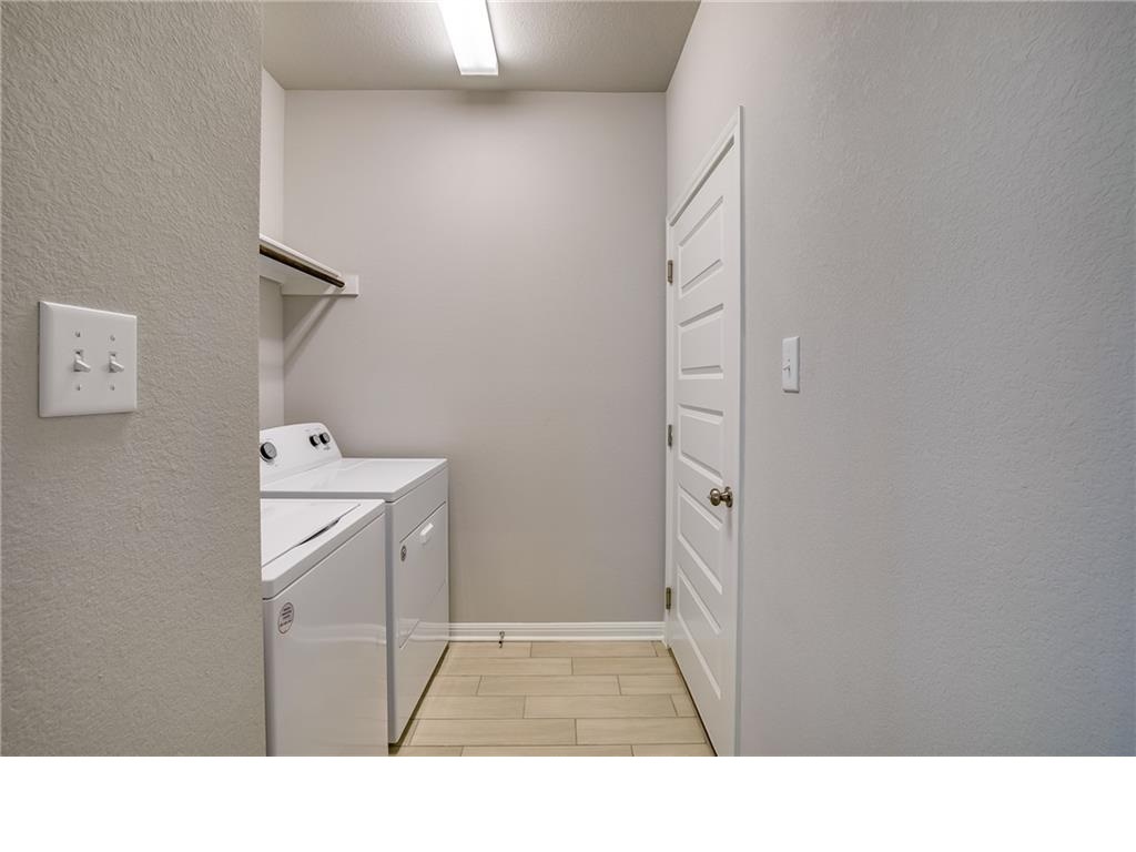 237 Unforgiven Lane Jarrell, TX 76537 - Photo 13 of 20 a bathroom with a sink a mirror and a shower