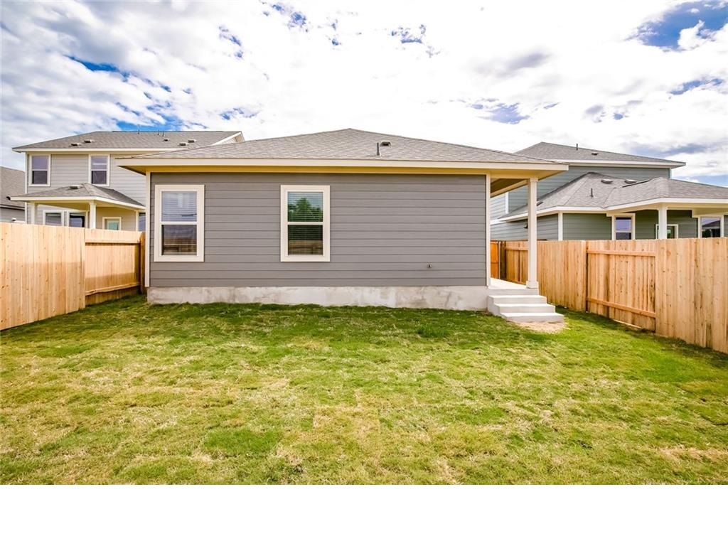 237 Unforgiven Lane Jarrell, TX 76537 - Photo 14 of 20 a view of a house with a backyard